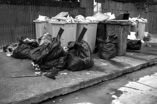 Team beginning an office clearance in Spitalfields with labelled recycling bins