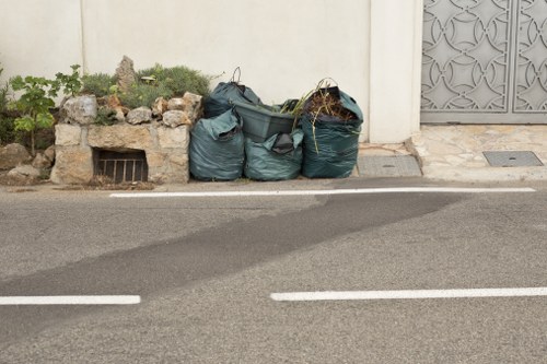 Expert team performing garden clearance in an urban garden